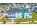 Aerial view of a charming two-story light blue house at 200 Delano Way, Myrtle Beach, SC 29588