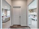 Bright hallway with doors to bedrooms and dark hardwood floors at 933 Laconic Dr., Myrtle Beach, SC 29588