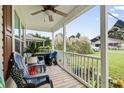 Front porch with seating and potted plants at 8032 Resin Rd., Murrells Inlet, SC 29576