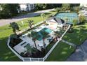 Community pool, tennis court, and clubhouse at 616 River Oaks Dr. # 54F, Myrtle Beach, SC 29579