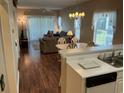 Open concept living and dining area with wood floors and sliding glass door at 616 River Oaks Dr. # 54F, Myrtle Beach, SC 29579