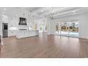 Open concept kitchen and living area with hardwood floors at 204 Bouquets Green Way, Myrtle Beach, SC 29579