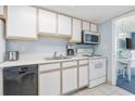 Well equipped condo kitchen with white cabinets and appliances at 2701 South Ocean Blvd. # 1204, North Myrtle Beach, SC 29582