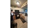 Small kitchen with appliances and wood cabinets at 3555 Highway 544 # 2D, Conway, SC 29526