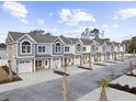 Multi-unit townhome community with attached garages at 904 62Nd Ave. N # C, Myrtle Beach, SC 29572