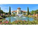 Charming gazebo with a fountain, nestled beside a pond in a manicured garden at 1224 Needle Grass Loop, Myrtle Beach, SC 29579