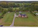 Aerial view of a brick house with a pool and detached garage at 1319 Clearview Ct., Loris, SC 29569