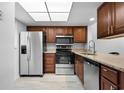 Modern kitchen with stainless steel appliances and granite countertops at 1301 Pridgen Rd. # 1008, Myrtle Beach, SC 29577