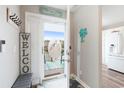 Inviting entryway with beachy decor and access to a private porch at 4755 Lightkeepers Way # 15-F, Little River, SC 29566
