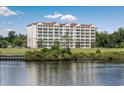 Building waterfront view, with lawn and trees at 2151 Bridgeview Ct. # 3-303, North Myrtle Beach, SC 29582