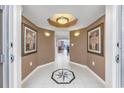 Spacious entryway with tile floor and artwork at 2151 Bridgeview Ct. # 3-303, North Myrtle Beach, SC 29582