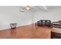 Bright living room with hardwood floors and a comfy couch at 141 Terracina Circle, Myrtle Beach, SC 29588