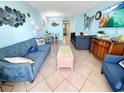 Beach-themed living room with comfortable seating and dining area at 2000 Ocean Blvd. S # 306, Myrtle Beach, SC 29577