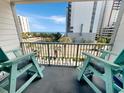 Balcony view with oceanfront seating and partial ocean view at 2000 Ocean Blvd. S # 306, Myrtle Beach, SC 29577