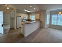 Kitchen with breakfast bar and white cabinets at 4870 Luster Leaf Circle # 401, Myrtle Beach, SC 29577