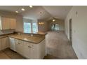 Open concept kitchen and living room with vaulted ceiling at 4870 Luster Leaf Circle # 401, Myrtle Beach, SC 29577