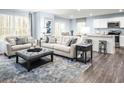 Spacious living room featuring neutral-toned couches and a large rug at 1092 Oak Meadow Dr., Conway, SC 29526