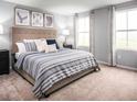 Large bedroom with king-size bed and neutral color palette at 1092 Oak Meadow Dr., Conway, SC 29526