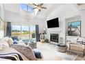 Spacious living room with fireplace, water views, and sectional sofa at 4396 Baldwin Ave. # 12, Little River, SC 29566