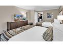 Hotel bedroom with two double beds and kitchenette view at 1105 Ocean Blvd. S # 412, Myrtle Beach, SC 29577