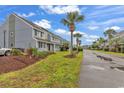 Townhome community with lush landscaping and palm trees at 1890 Colony Dr. # 17-S, Myrtle Beach, SC 29575