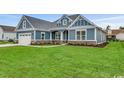 Two-story home with blue siding and stone accents at 1104 Maccoa Dr., Conway, SC 29526
