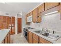 Condo kitchen with wood cabinets and appliances at 215 Double Eagle Dr. # G-2, Myrtle Beach, SC 29575