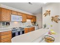 Condo kitchen with wood cabinets and appliances at 215 Double Eagle Dr. # G-2, Myrtle Beach, SC 29575