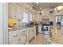 Spacious kitchen with granite countertops and custom cabinetry at 6001 S Kings Hwy., Myrtle Beach, SC 29575