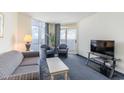 Ocean-view living room features comfy seating and a TV at 2711 S Ocean Blvd. # 1915, North Myrtle Beach, SC 29582