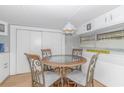 Cozy dining area with a round table and four chairs at 6001-1424 S Kings Hwy., Myrtle Beach, SC 29575
