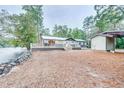 House exterior view showing deck and riverfront lot at 7122 Cox Lake Dr., Mullins, SC 29574