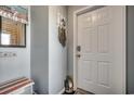 Condo entryway with bench and decor at 415 N Ocean Blvd. # 302, Surfside Beach, SC 29575