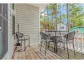 Small deck with wicker patio furniture at 6001-1359 S Kings Hwy., Myrtle Beach, SC 29575