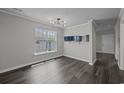 Bright dining room with hardwood floors and window at 4251 Villas Dr. # 309, Little River, SC 29566