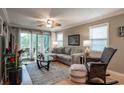 Bright living room with comfy seating, hardwood floors, and sliding glass doors leading to a patio at 366 Pinehurst Ln. # 13D, Pawleys Island, SC 29585