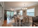 Elegant dining room featuring a wood table and chairs, with views into the living room at 366 Pinehurst Ln. # 13D, Pawleys Island, SC 29585
