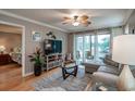 Open living room showcasing a sectional sofa, flat-screen TV and access to a bedroom at 366 Pinehurst Ln. # 13D, Pawleys Island, SC 29585