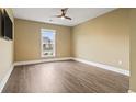 Bright bedroom with wood-look floors and a ceiling fan at 7129 Spoleto Dr., Myrtle Beach, SC 29572