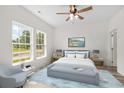 Bright bedroom with large windows and a cozy seating area at 1234 St. John Rd., Galivants Ferry, SC 29544
