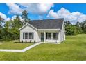 Newly built single Gathering home with front yard and walkway at 1234 St. John Rd., Galivants Ferry, SC 29544