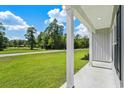 Front porch overlooking the yard and street at 1174 St. John Rd., Galivants Ferry, SC 29544