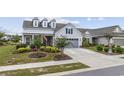 Nice gray house with a two-car garage and well-manicured landscaping at 6438 Cascata Dr., Myrtle Beach, SC 29572