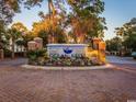 Community entrance with brick columns, landscaping, and a lit sign at 601 N Hillside Dr. # 2123, North Myrtle Beach, SC 29582