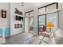 Spacious living room with fireplace and balcony access at 1100 Possum Trot Rd. # H-355, North Myrtle Beach, SC 29582