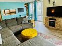 Spacious living room featuring a comfortable sectional sofa and large TV at 200 Landing Rd. # 111, North Myrtle Beach, SC 29582