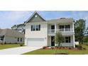 Two-story house with white siding and gray roof at 7034 Shooting Star Way, Myrtle Beach, SC 29579