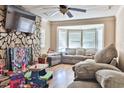 Cozy living room featuring a stone fireplace and bay window at 7990 Short Needle Ct., Murrells Inlet, SC 29576