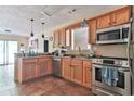 Kitchen boasts stainless steel appliances and ample wood cabinetry at 7990 Short Needle Ct., Murrells Inlet, SC 29576