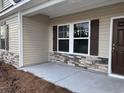 Front entrance with stonework and brown door at 428 Hallie Martin Rd., Conway, SC 29527